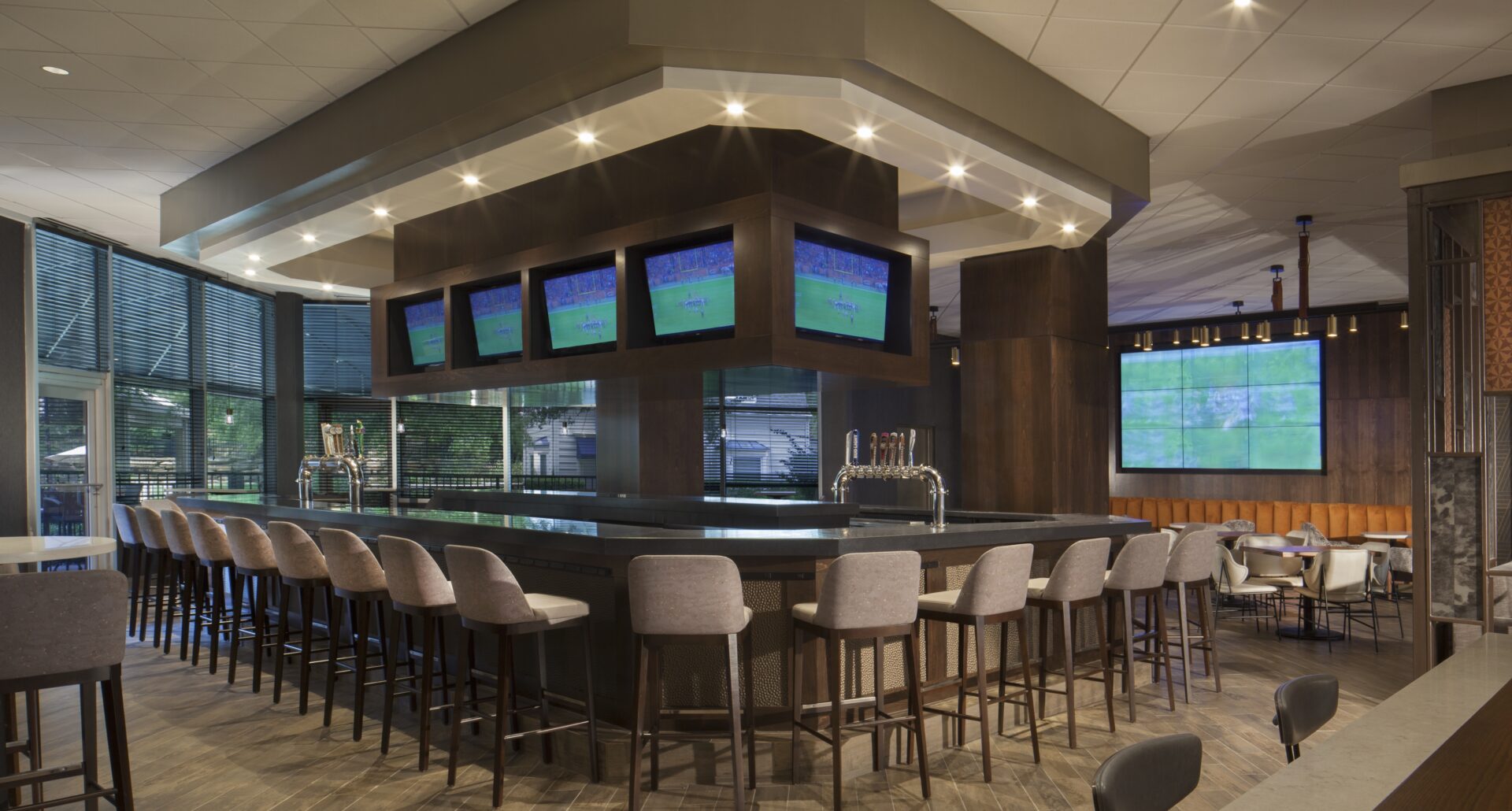 Photo of hotel bar with numerous features and finishes