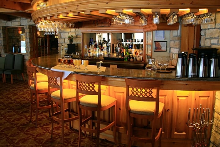 Photo of curved commercial bar with wood finishes