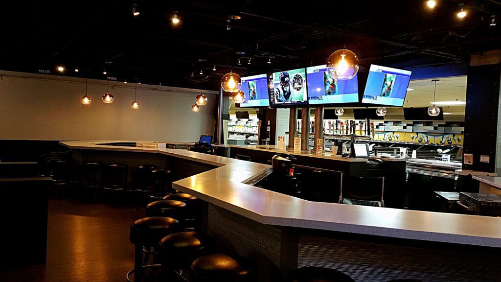 Photo of large island bar and back bar after redesign